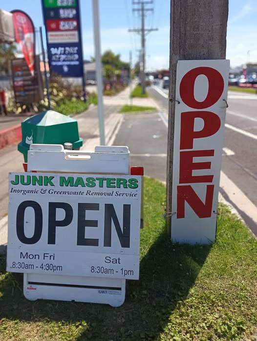 OPEN sandwich-board outside the shop, hours listed